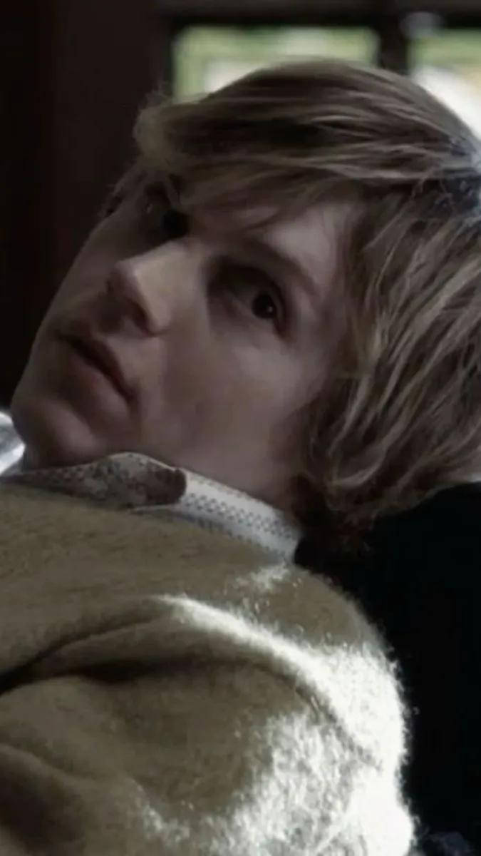 ai character: Tate Langdon  background