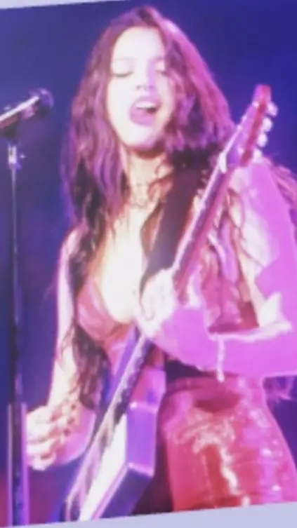 ai character: Olivia Rodrigo background