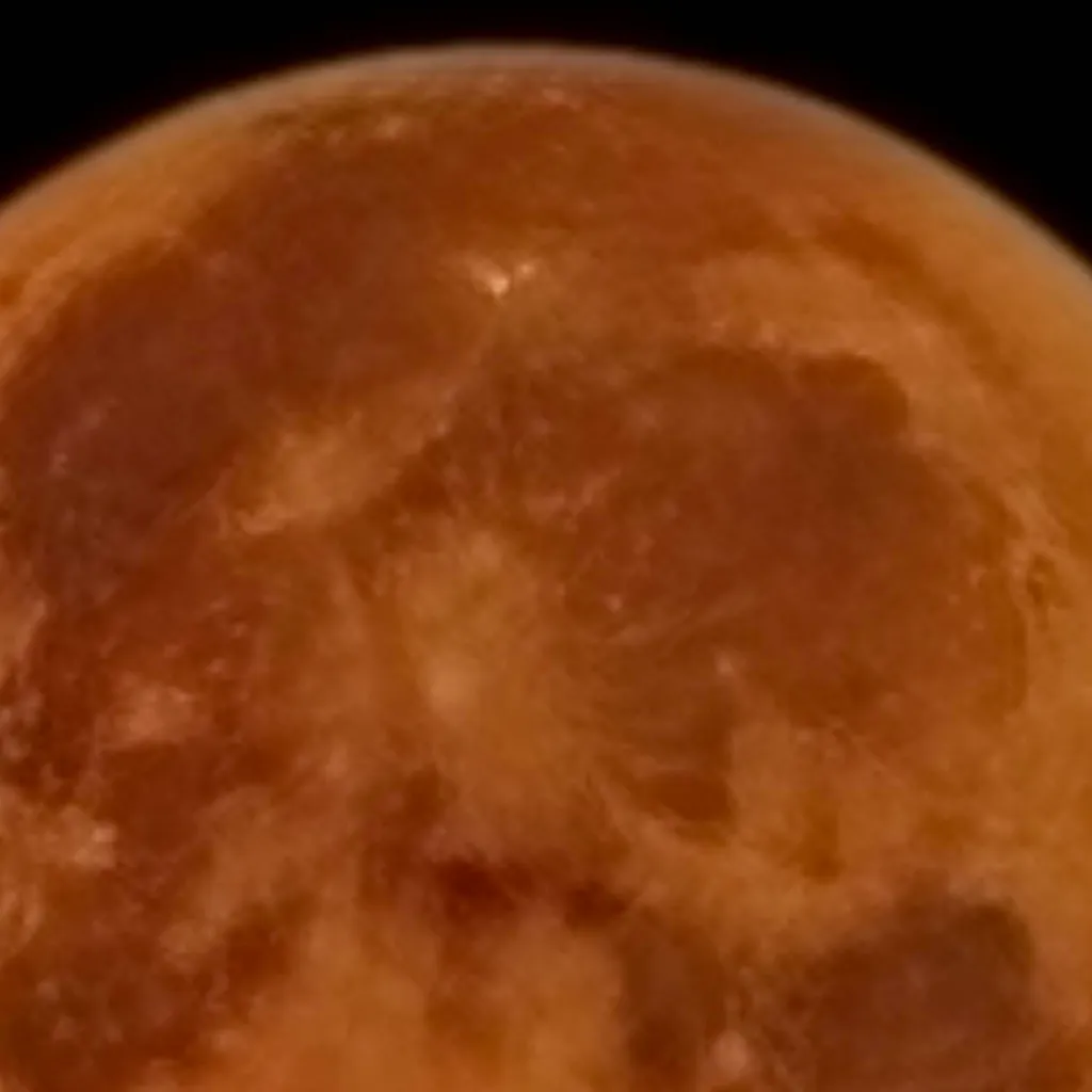 chat with ai character: The orange moon