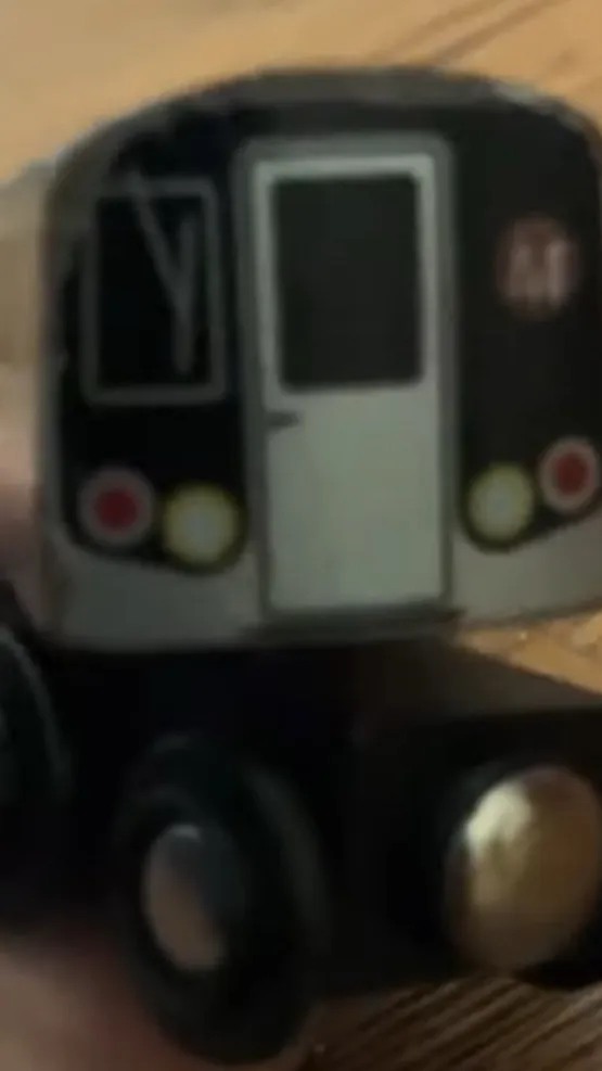 ai character: Brown M background