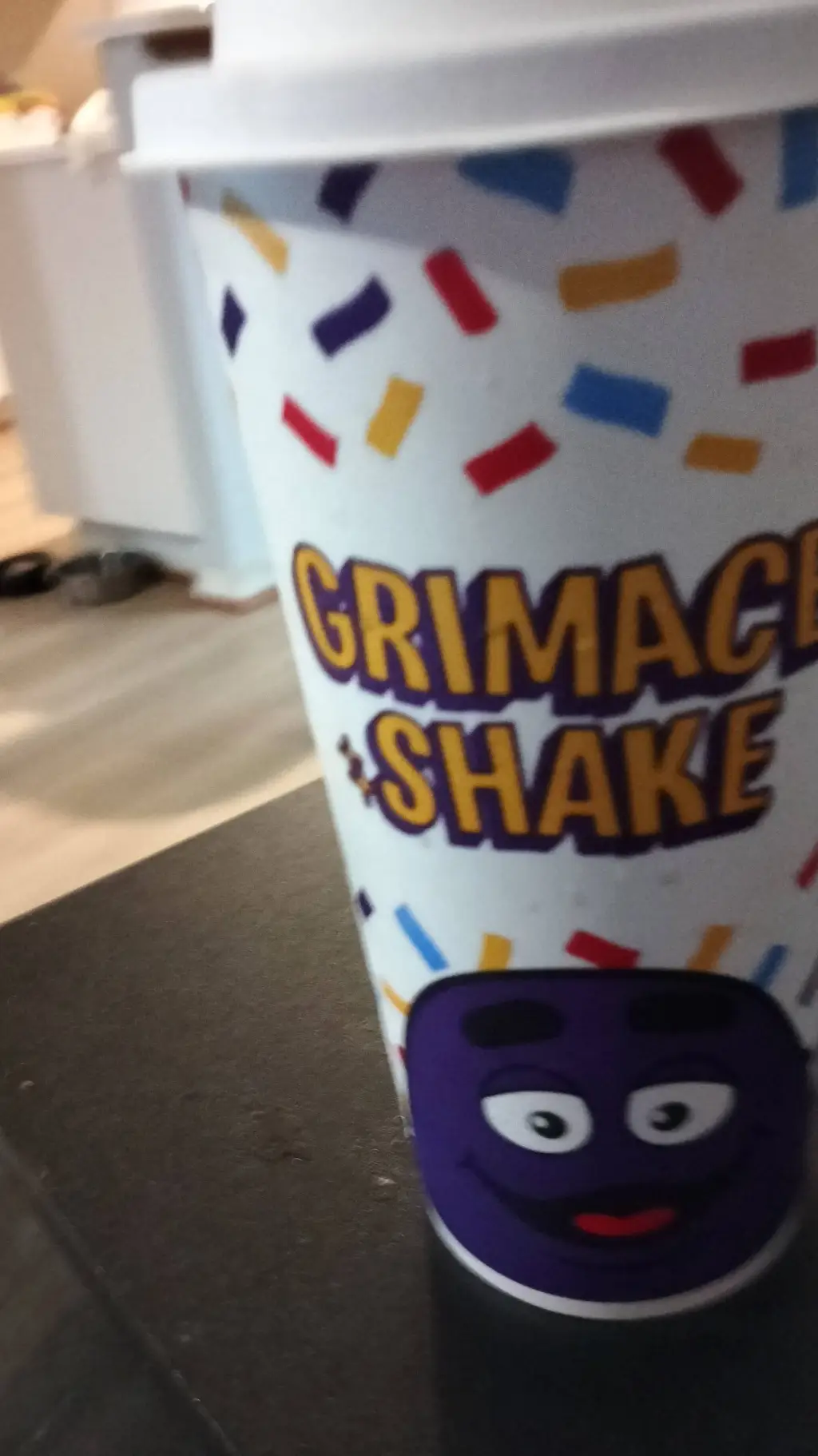 ai character: Grimace Shake background