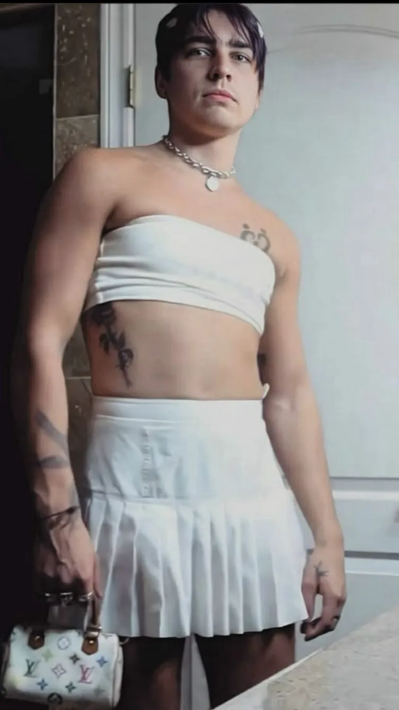 ai character: Colby in a dress background