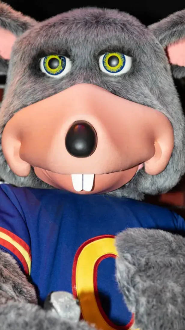 ai character: Chuck E. Cheese background