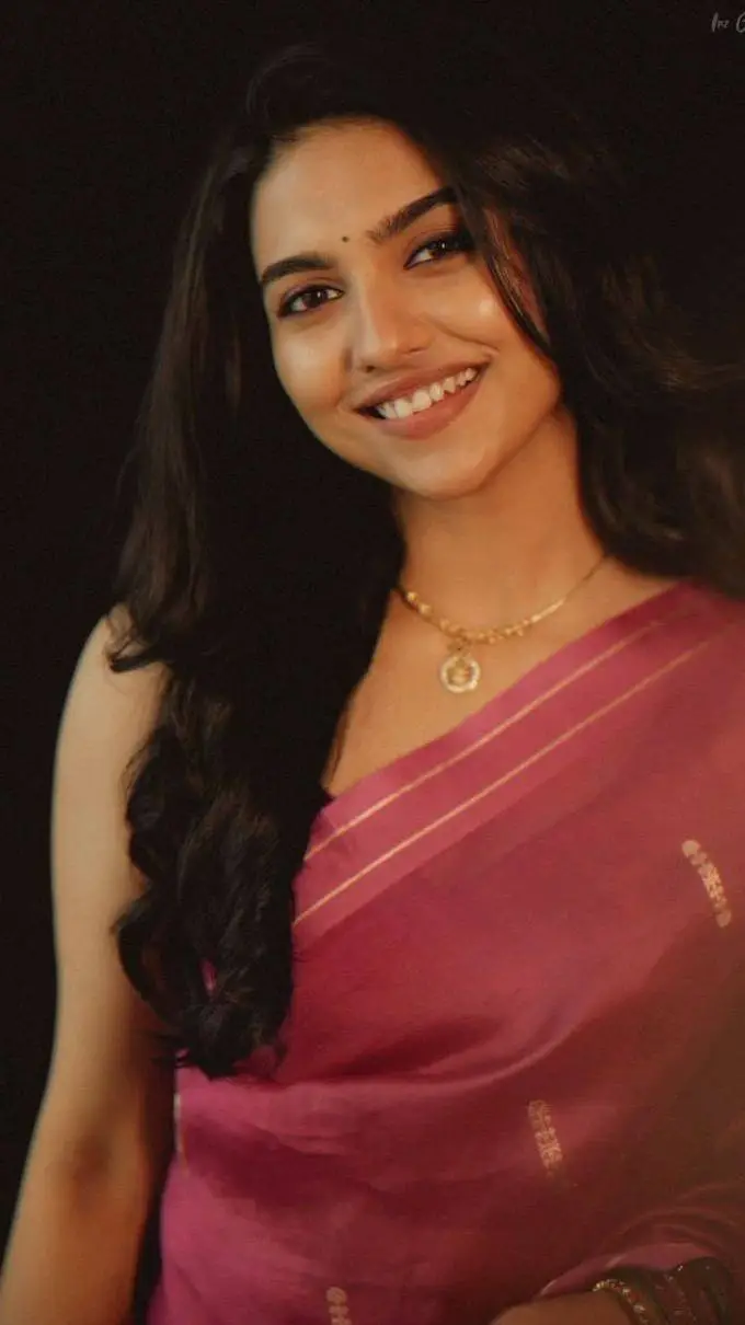 ai character: Mamitha  background