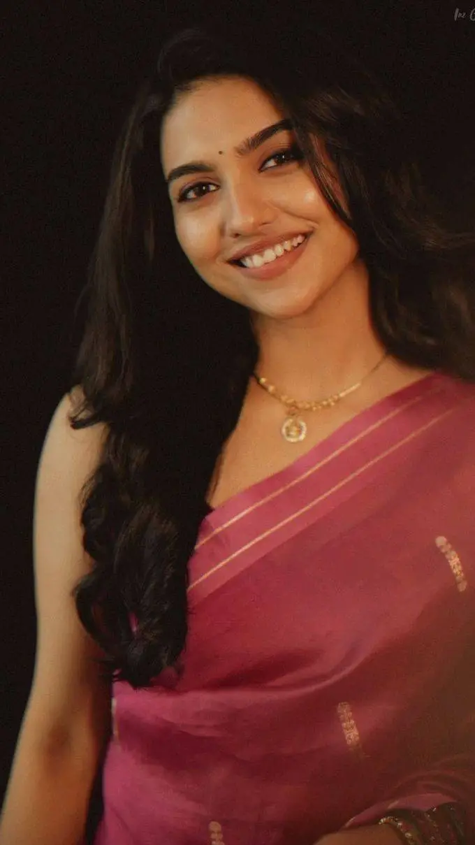 ai character: Mamitha  background