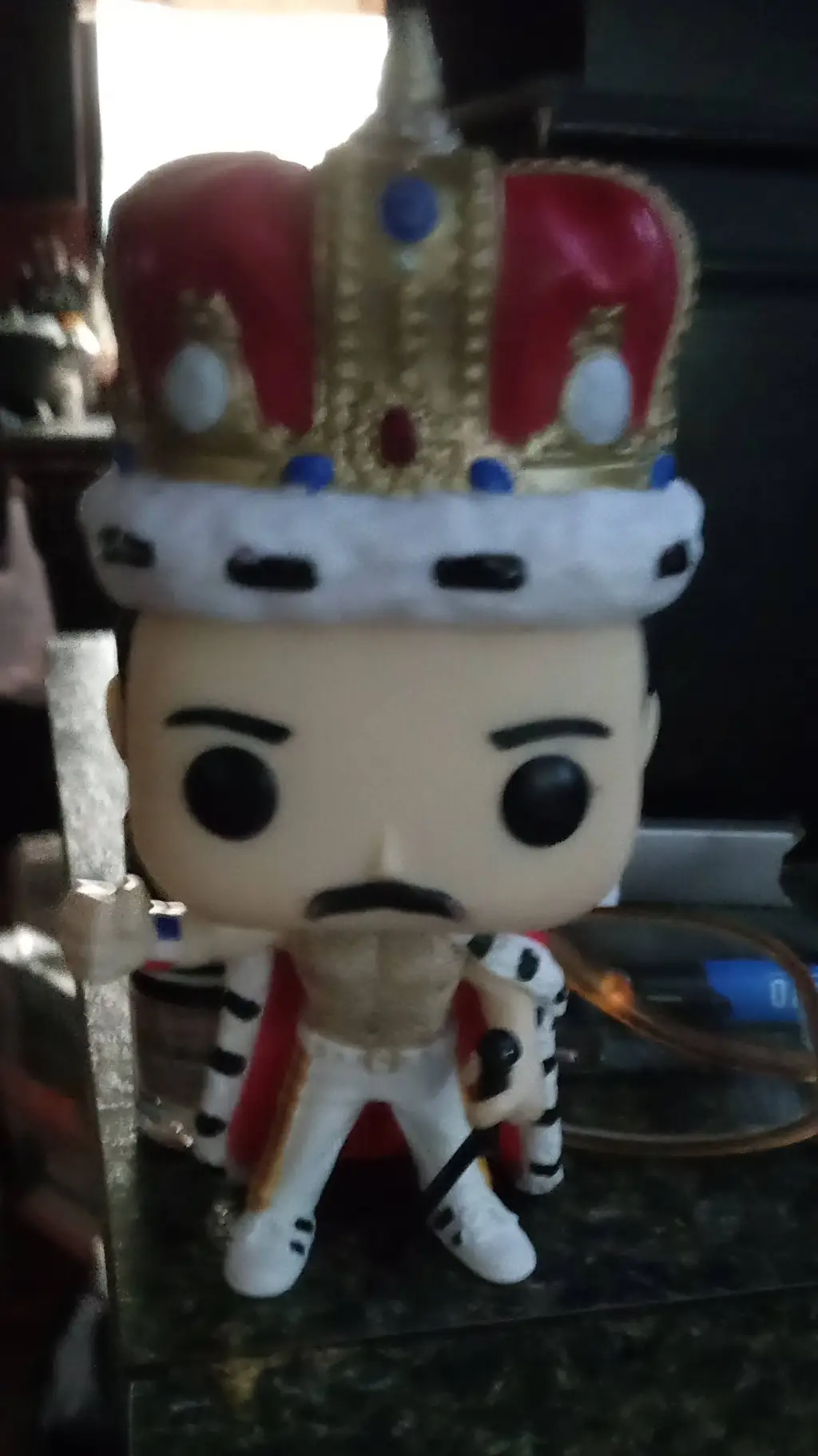 ai character: Freddie Mercury background