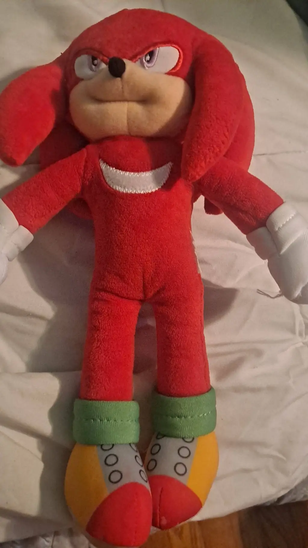 ai character: Knuckles plush background
