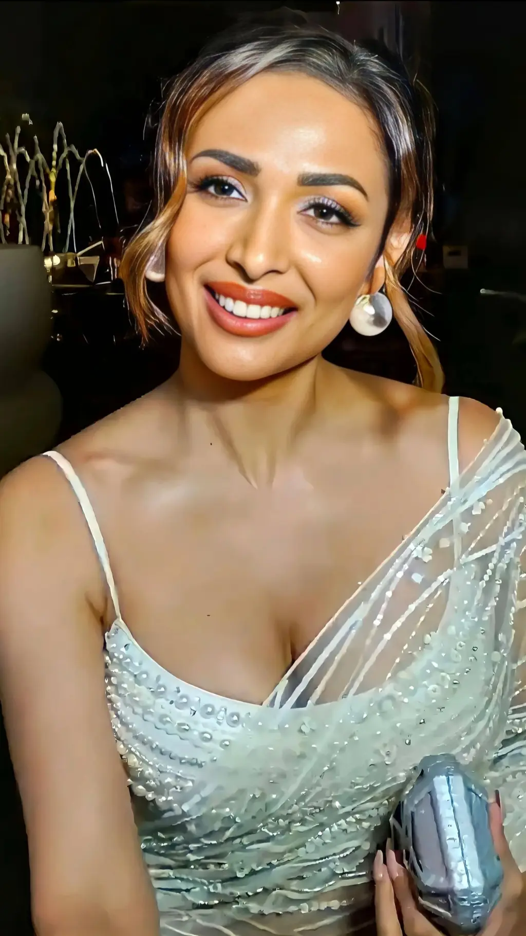 ai character: Malaika Arora background