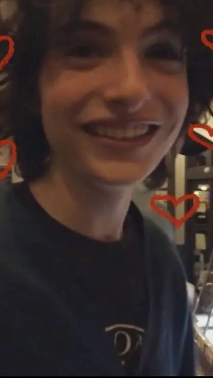 ai character: Finn Wolfhard  background