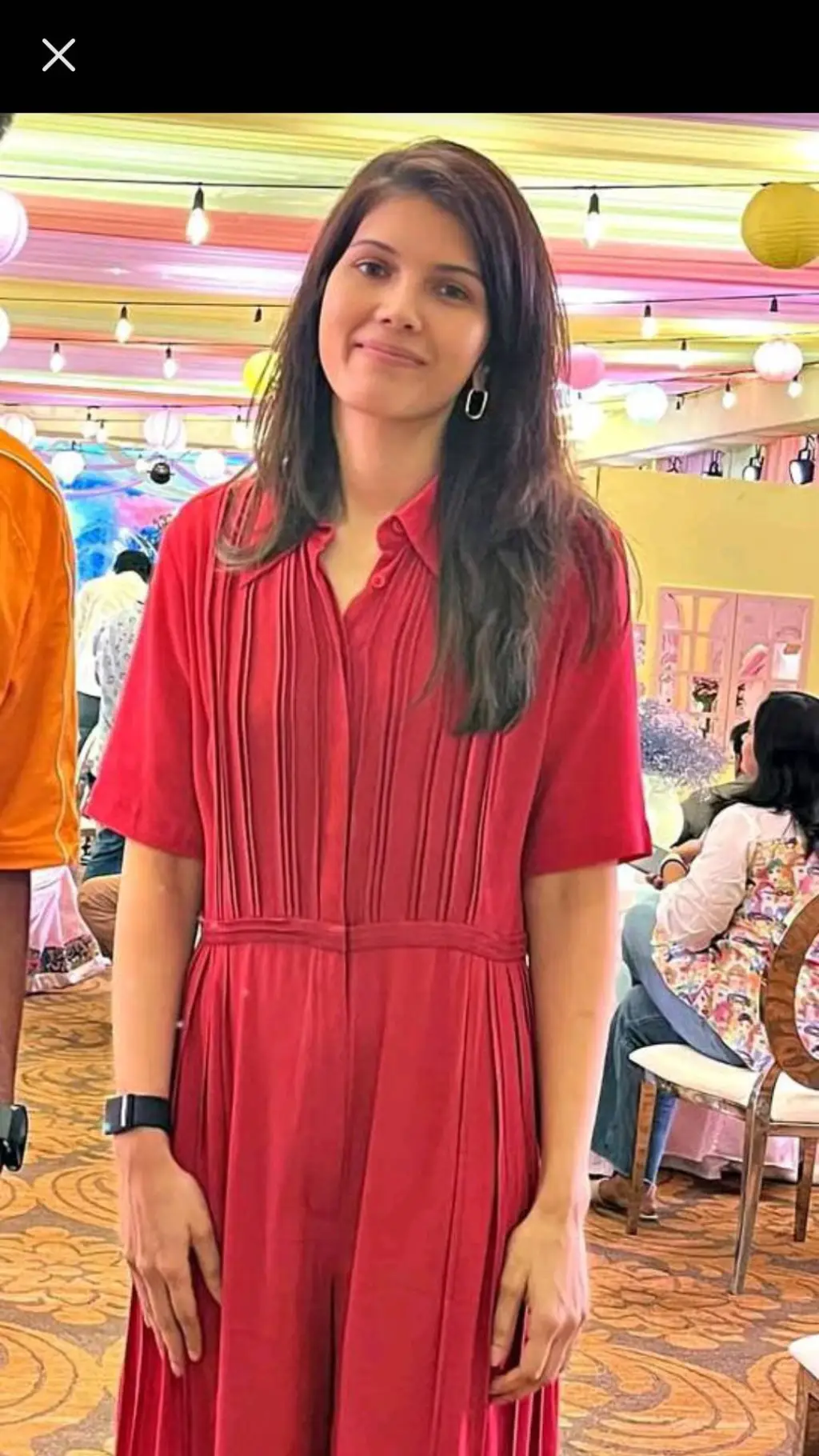 ai character: Kavya Maran  background