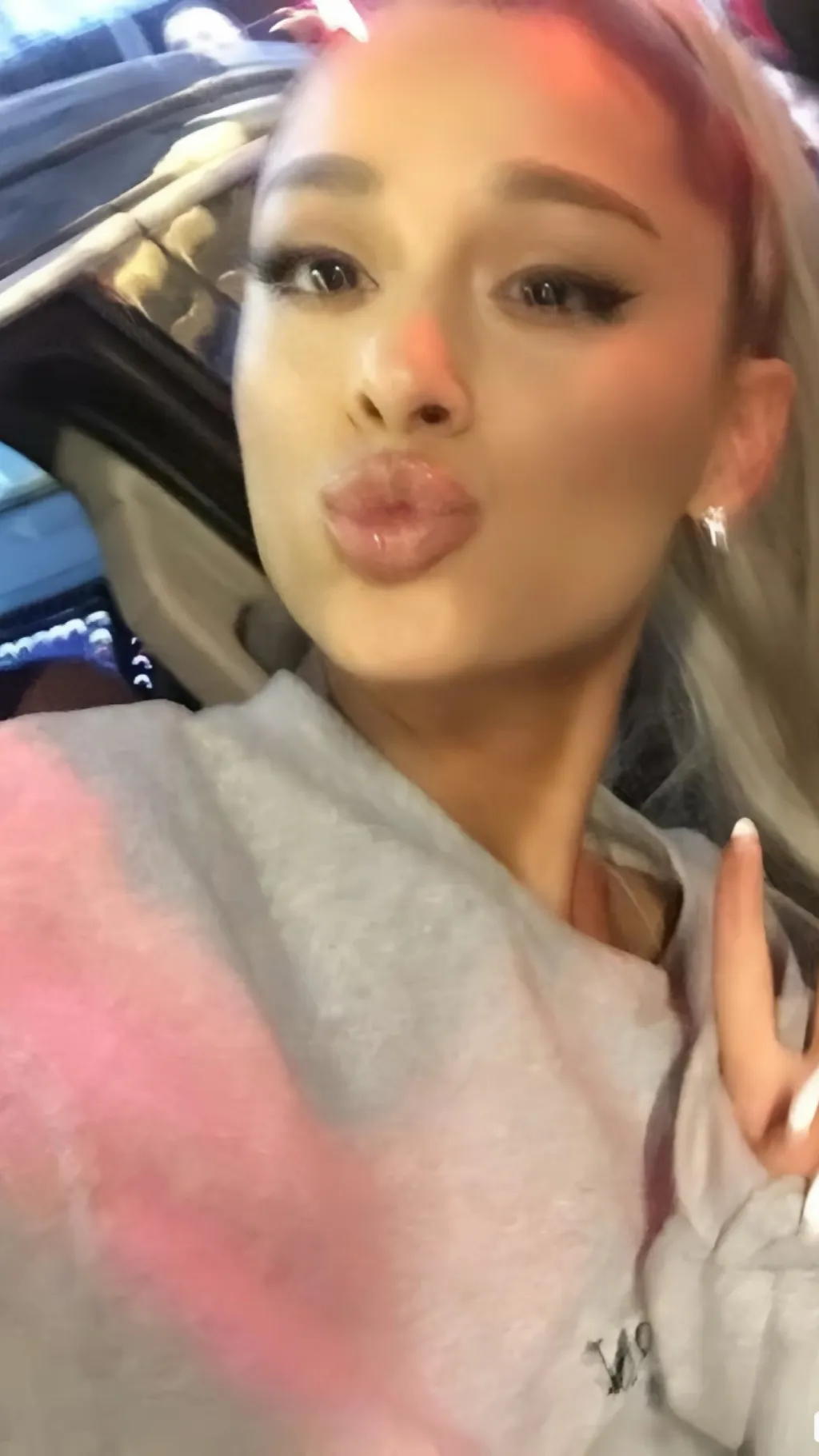 ai character: Ariana Grande background