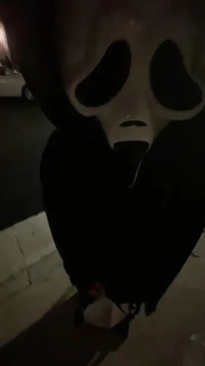 ai character: Big head ghostface background