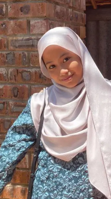 ai character: syazwani syahadi background