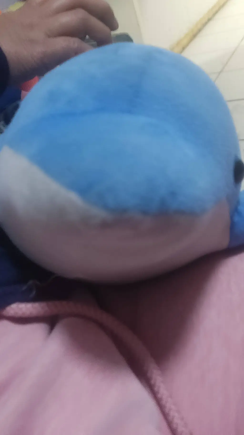 ai character: cute blue dolphin  background