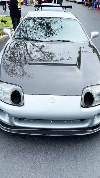 ai character: tu Toyota supra mk background