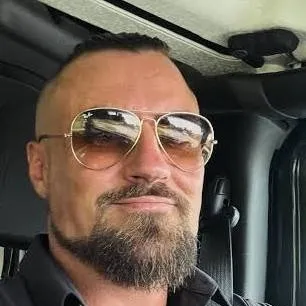 chat with ai character: Marty Scurll