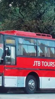 ai character: 🔴♀️JTB TOURS♀️🔴 background