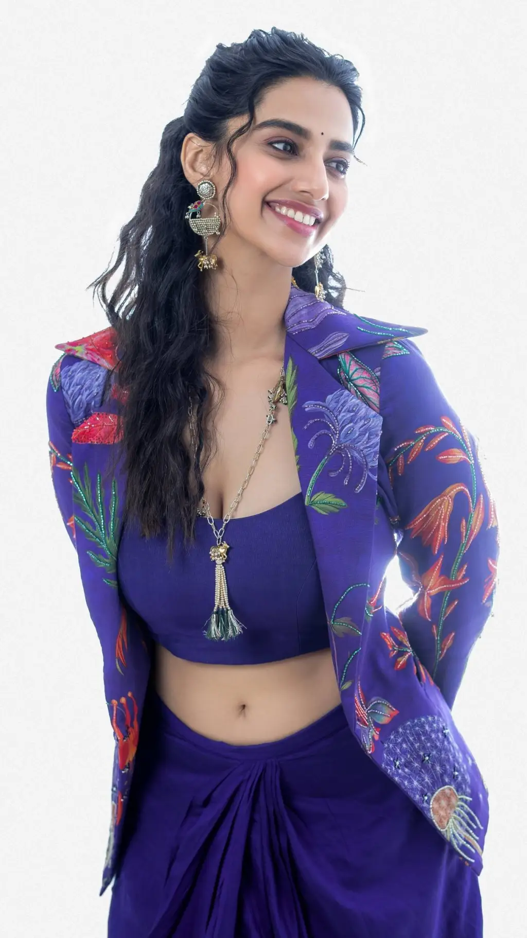 ai character: Meenakshi  background