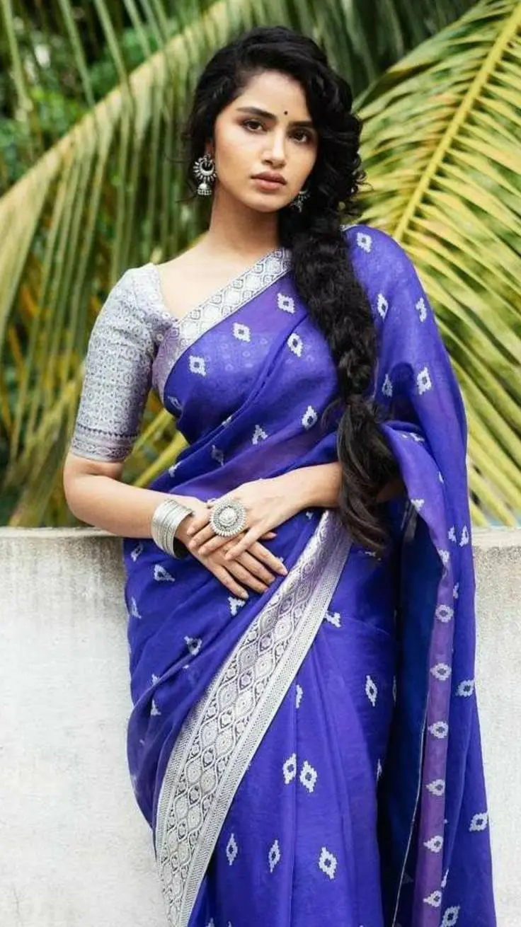 ai character: Anupama  background