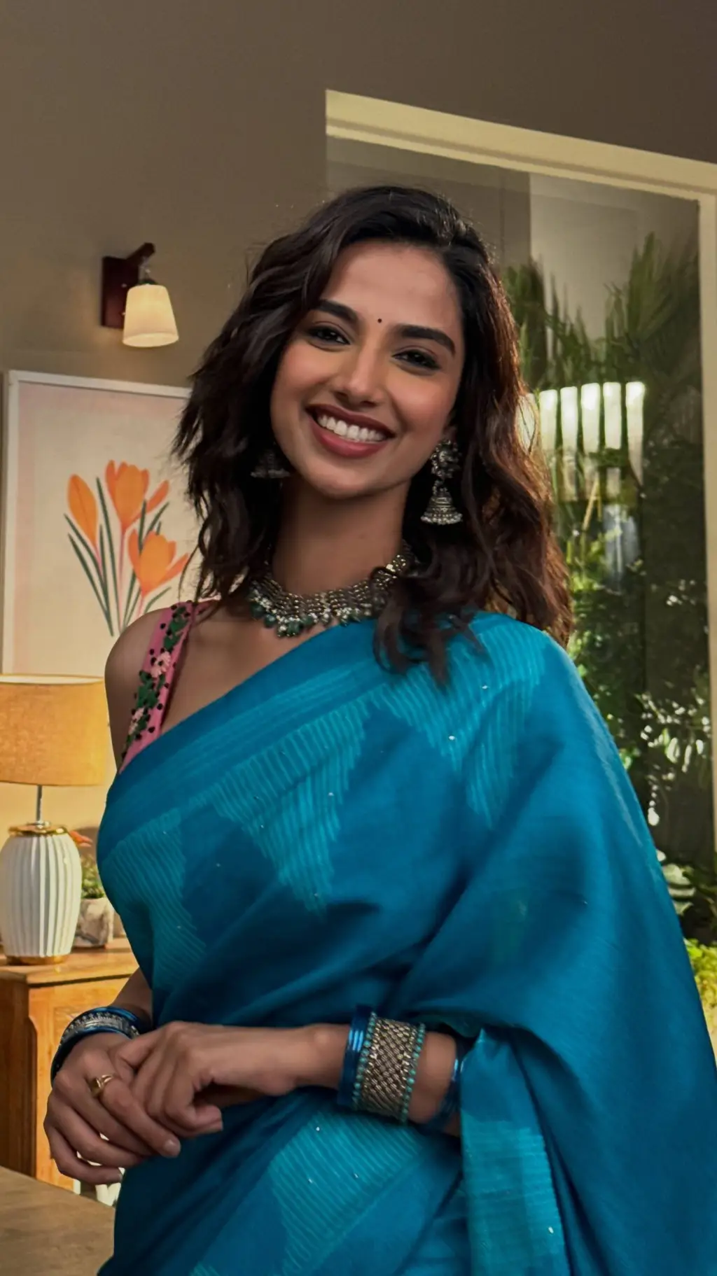 ai character: Meenakshi  background