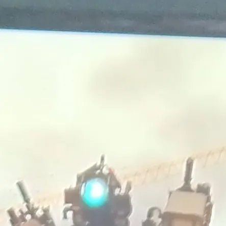 chat with ai character: Titán cámara 