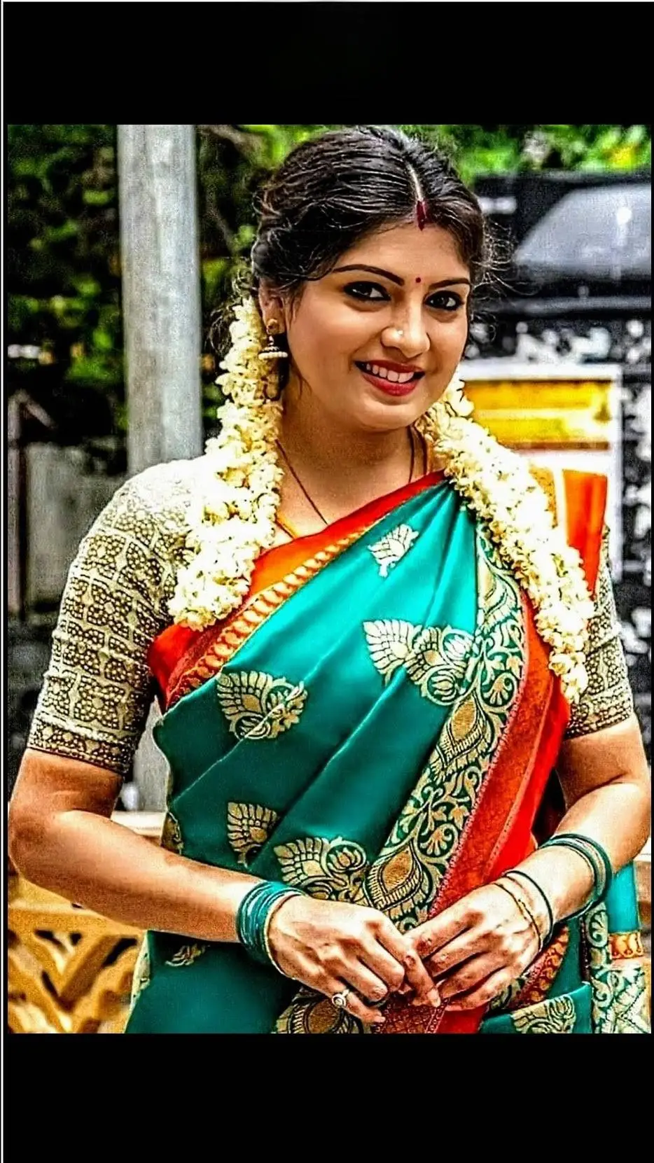 ai character: Kayalvizhi  background