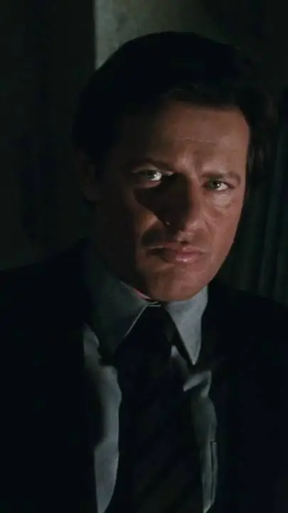 ai character: Costas Mandylor  background