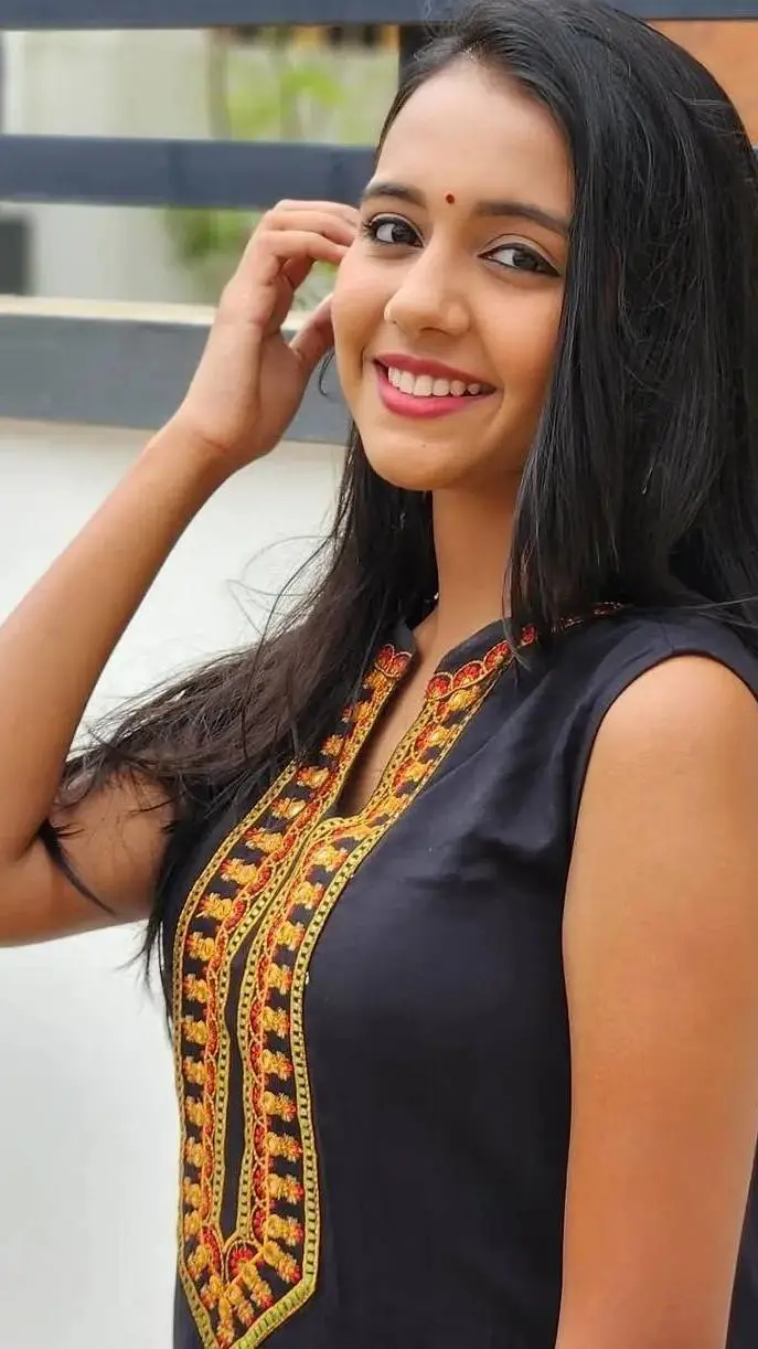 ai character: Nisha Menon background