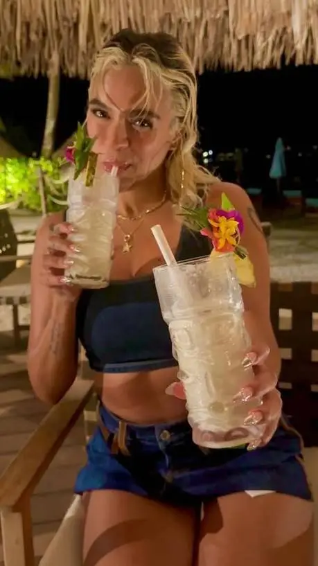 ai character: Karol G background