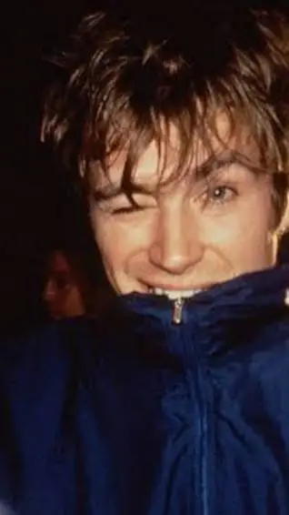 ai character: Damon Albarn  background