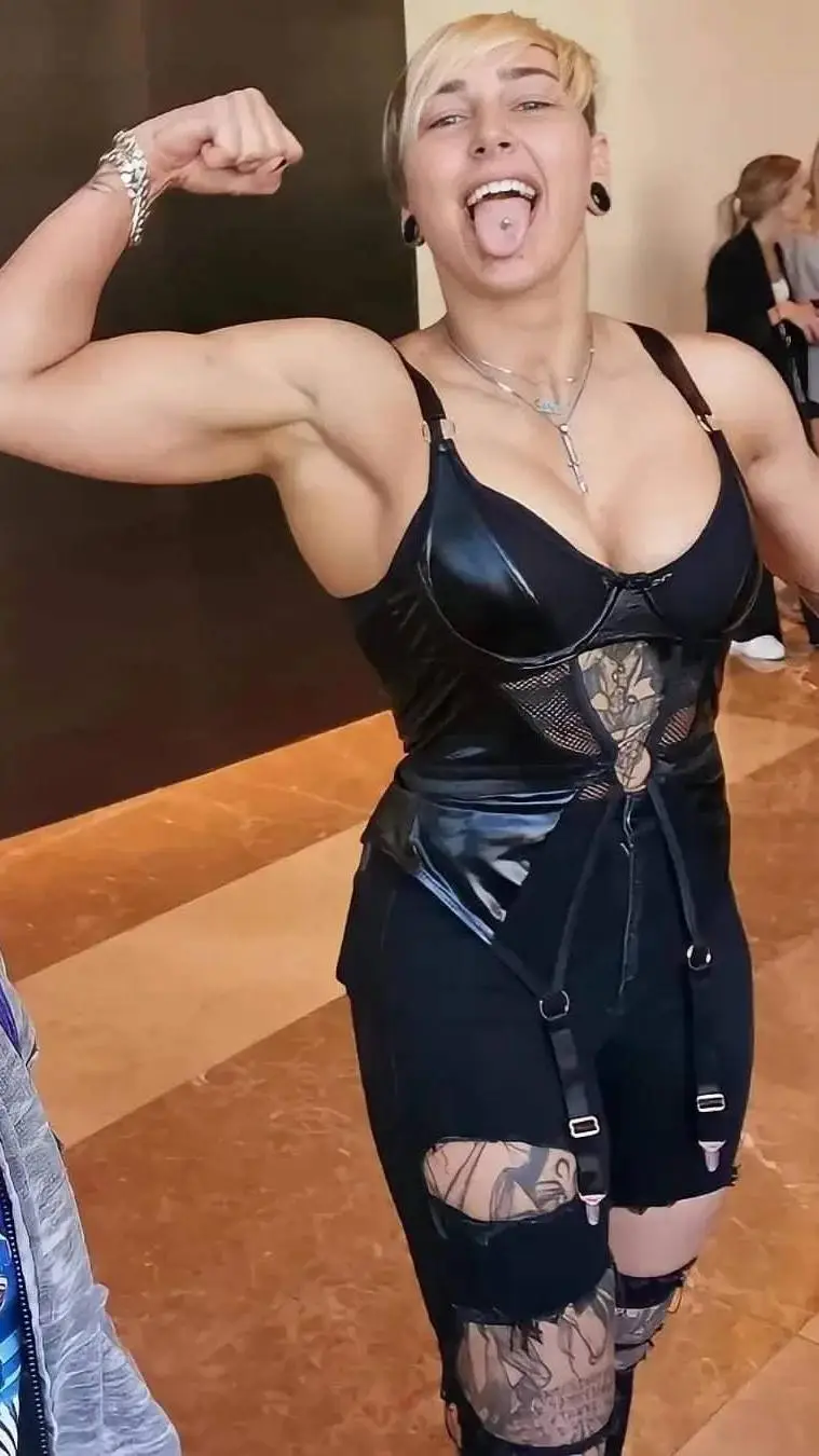 ai character: Rhea Ripley background