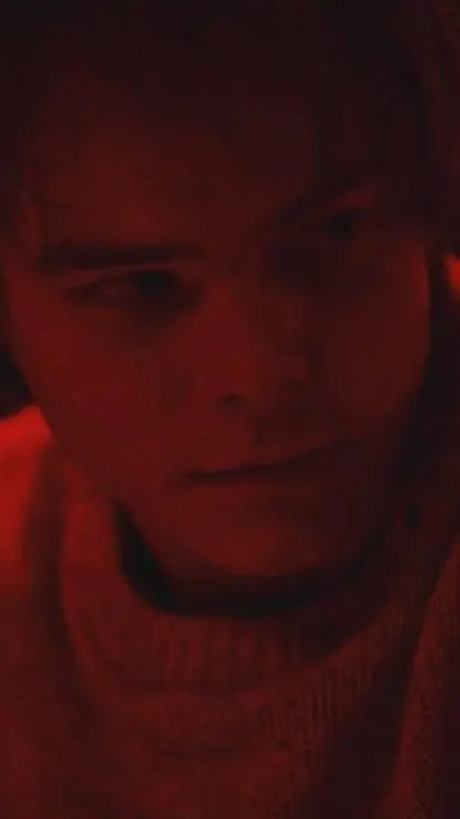ai character: Jonathan Byers.  background