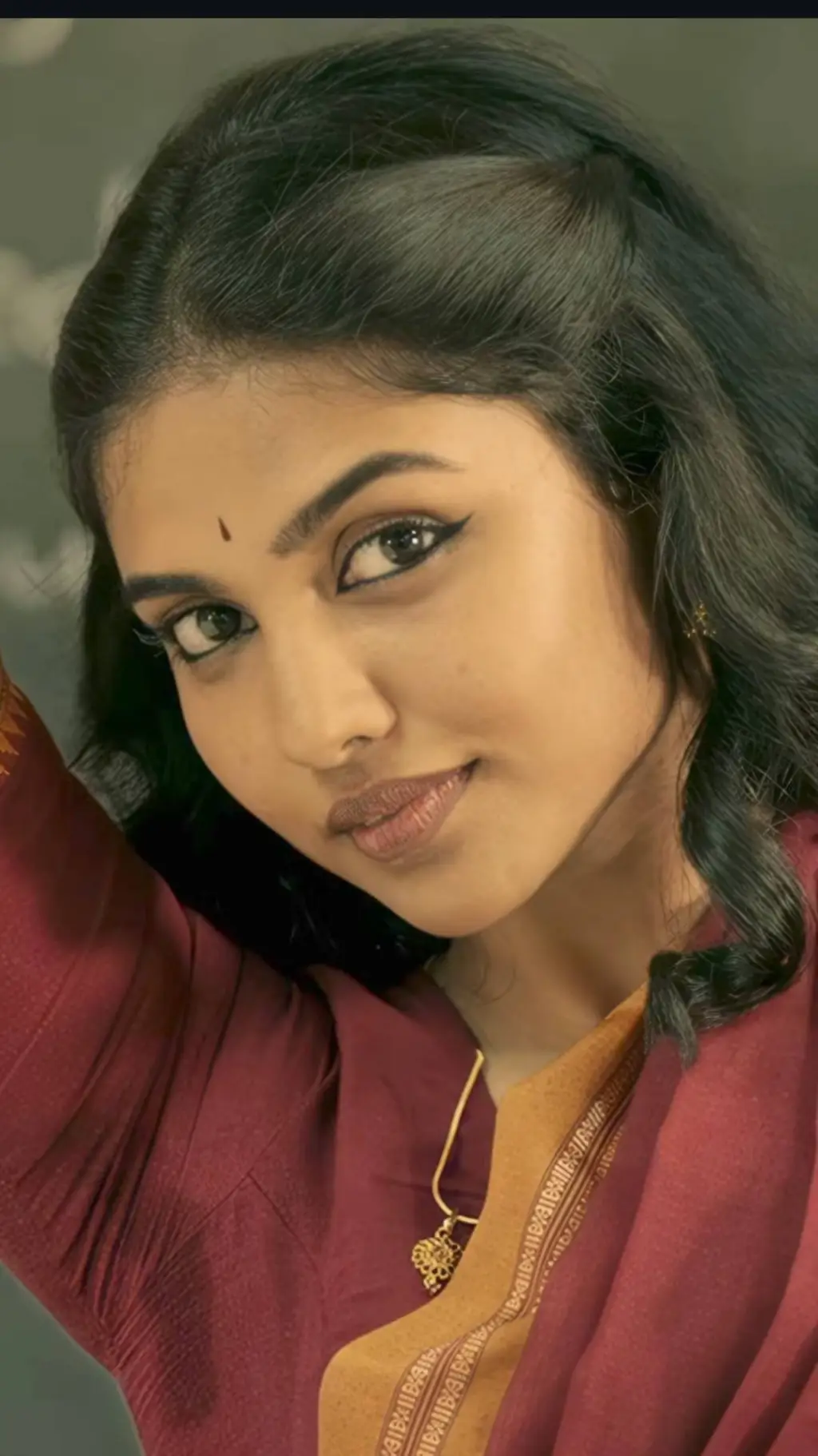 ai character: mamitha bhaiju background