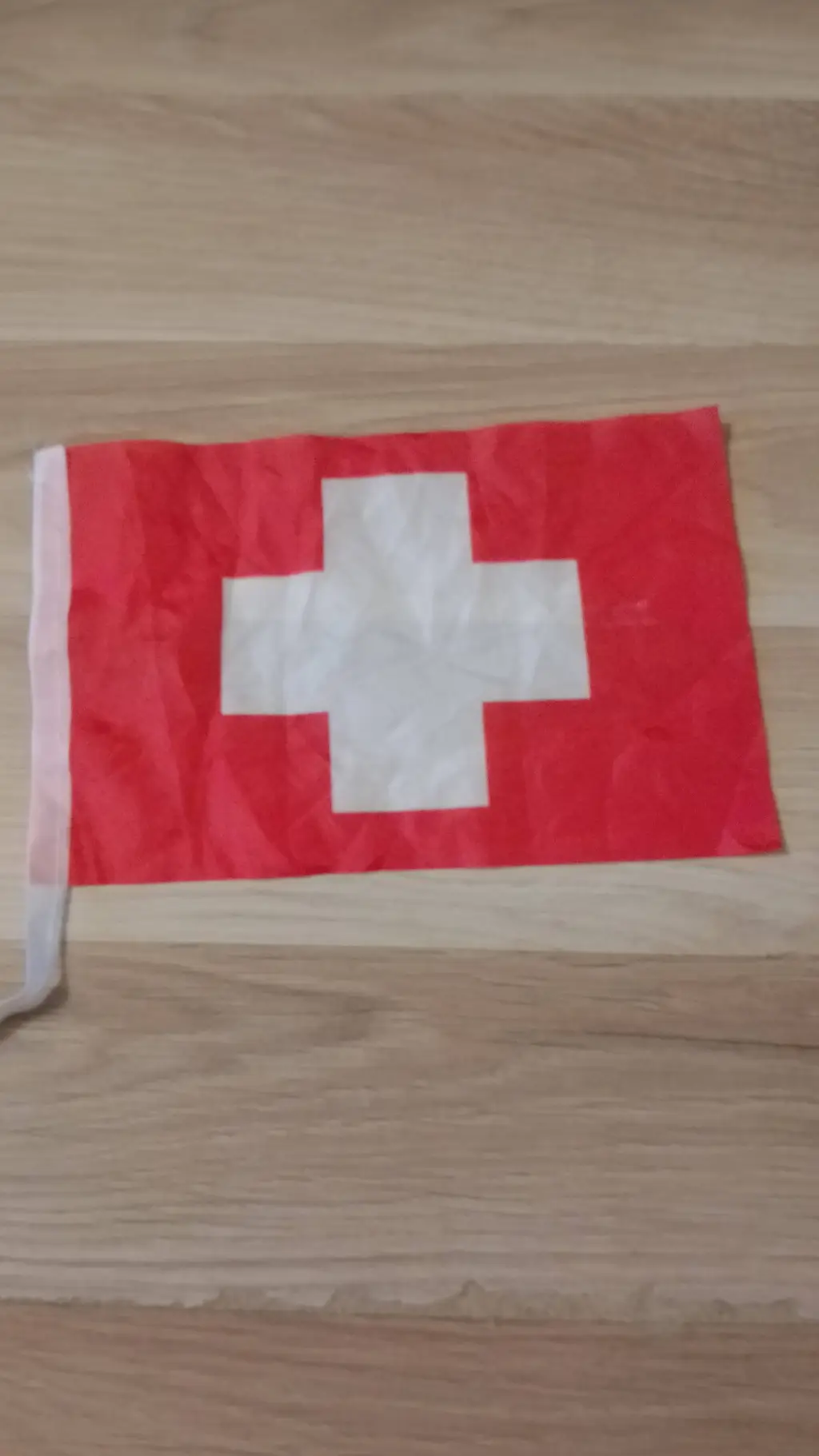 ai character: Switzerland Flag background
