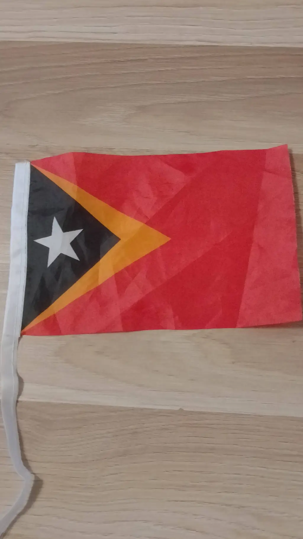 ai character: East Timor Flag background
