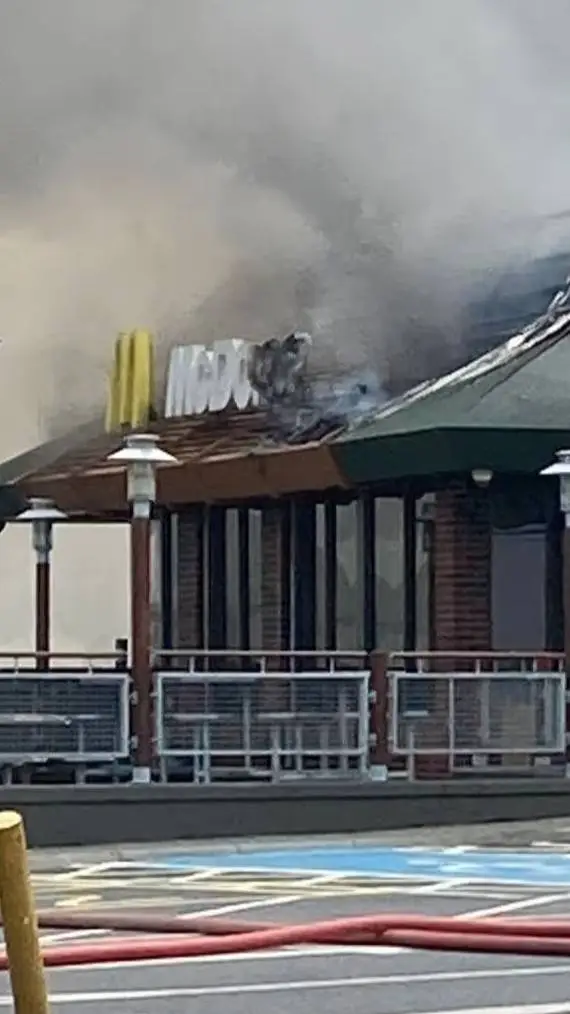 ai character: mcdonald's on fire background