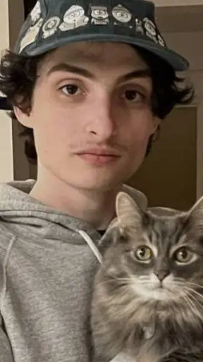 ai character: Finn Wolfhard  background