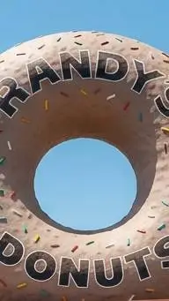 ai character: Randy's Donuts background