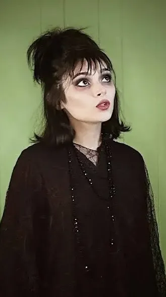 ai character: Lydia Deetz  background