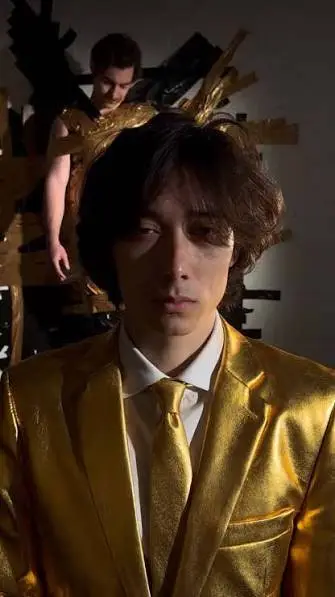 ai character: Gold Suit Guy background