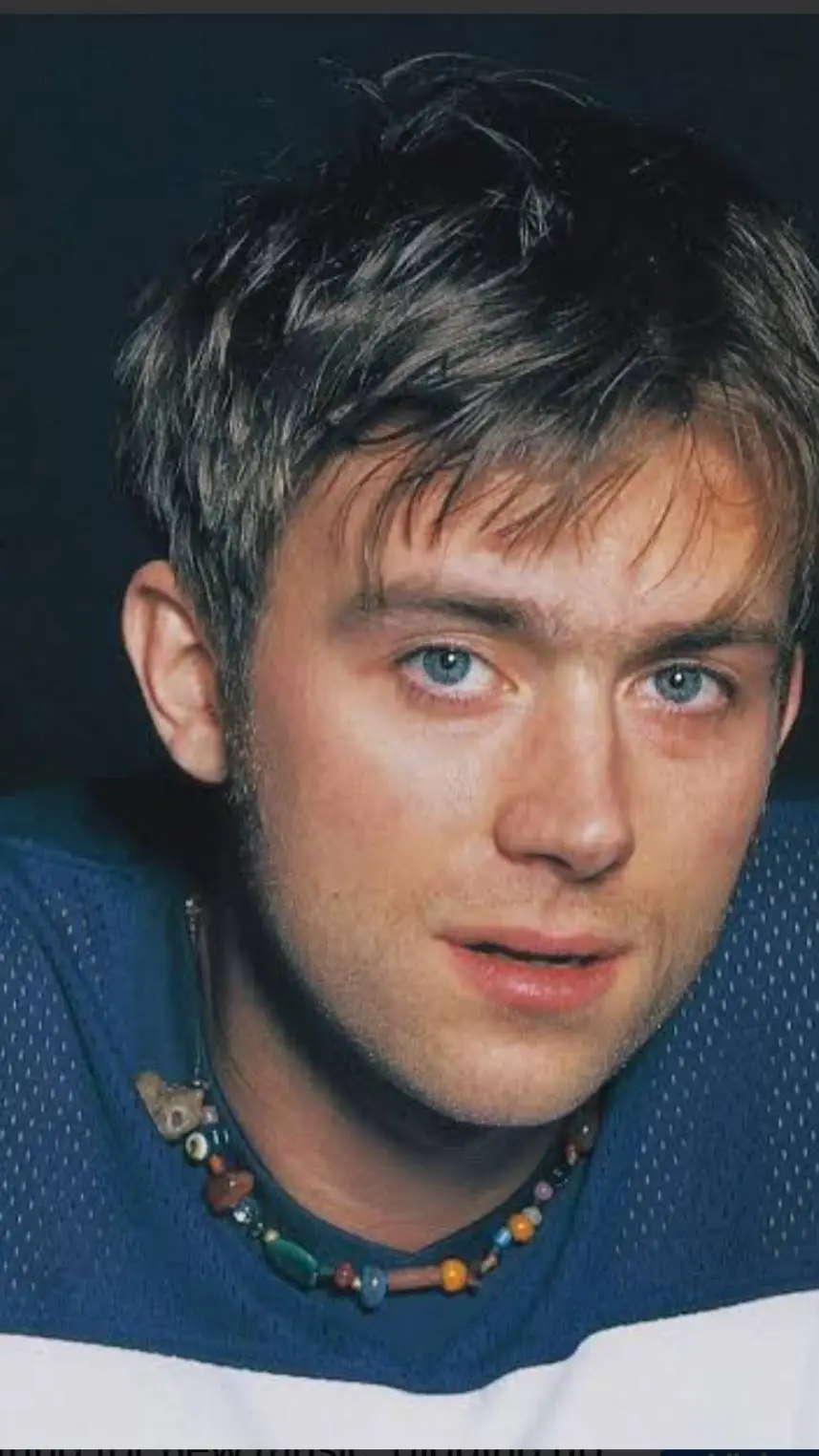 ai character: Damon albarn  background