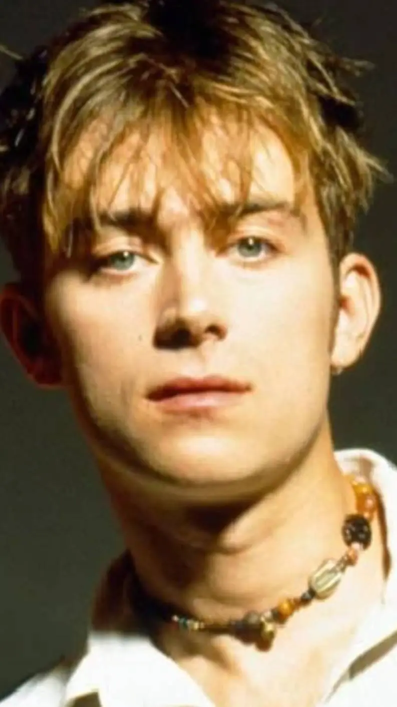 ai character: Damon albarn  background