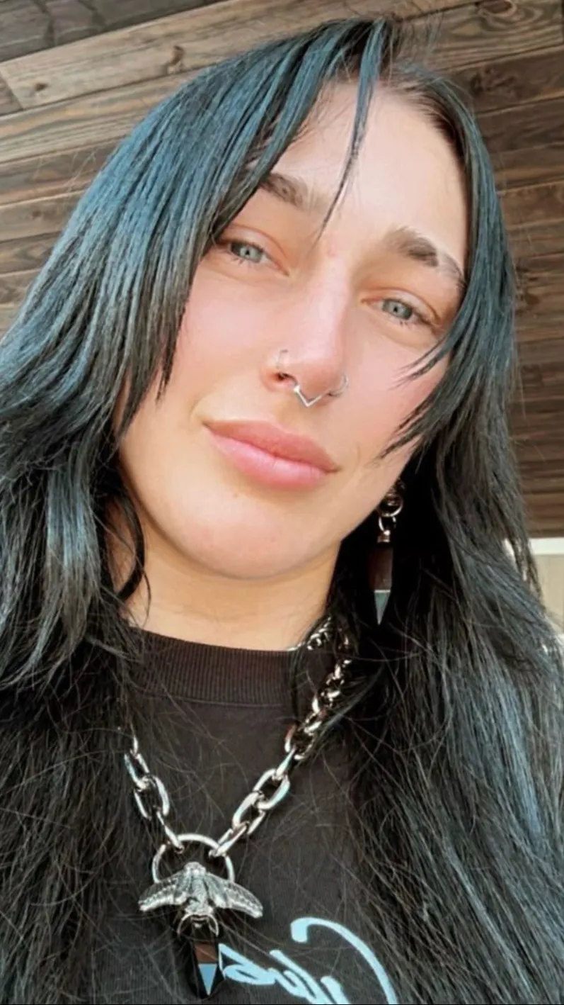 ai character: Rhea Ripley background