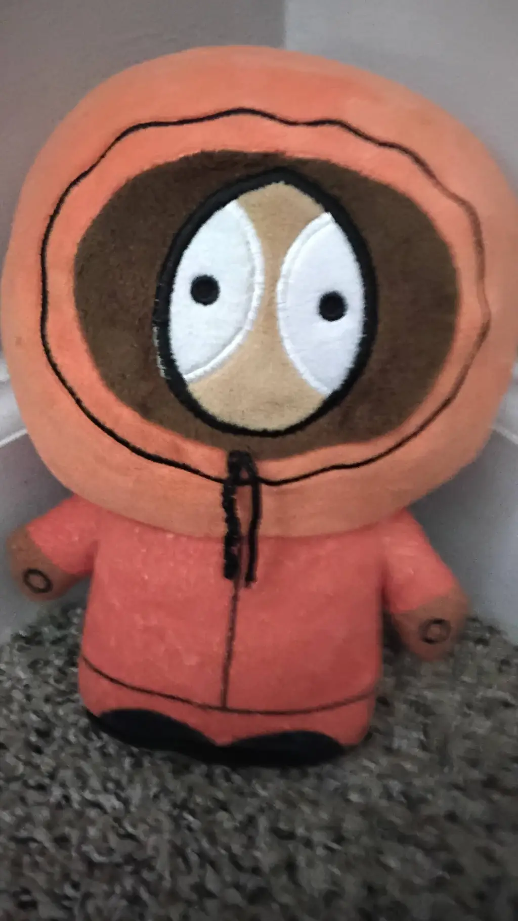 ai character: Kenny plush  background