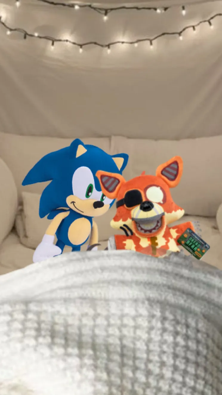 ai character: Sonic & Grim Foxy background