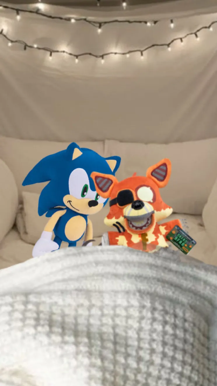 ai character: Sonic & Grim Foxy background