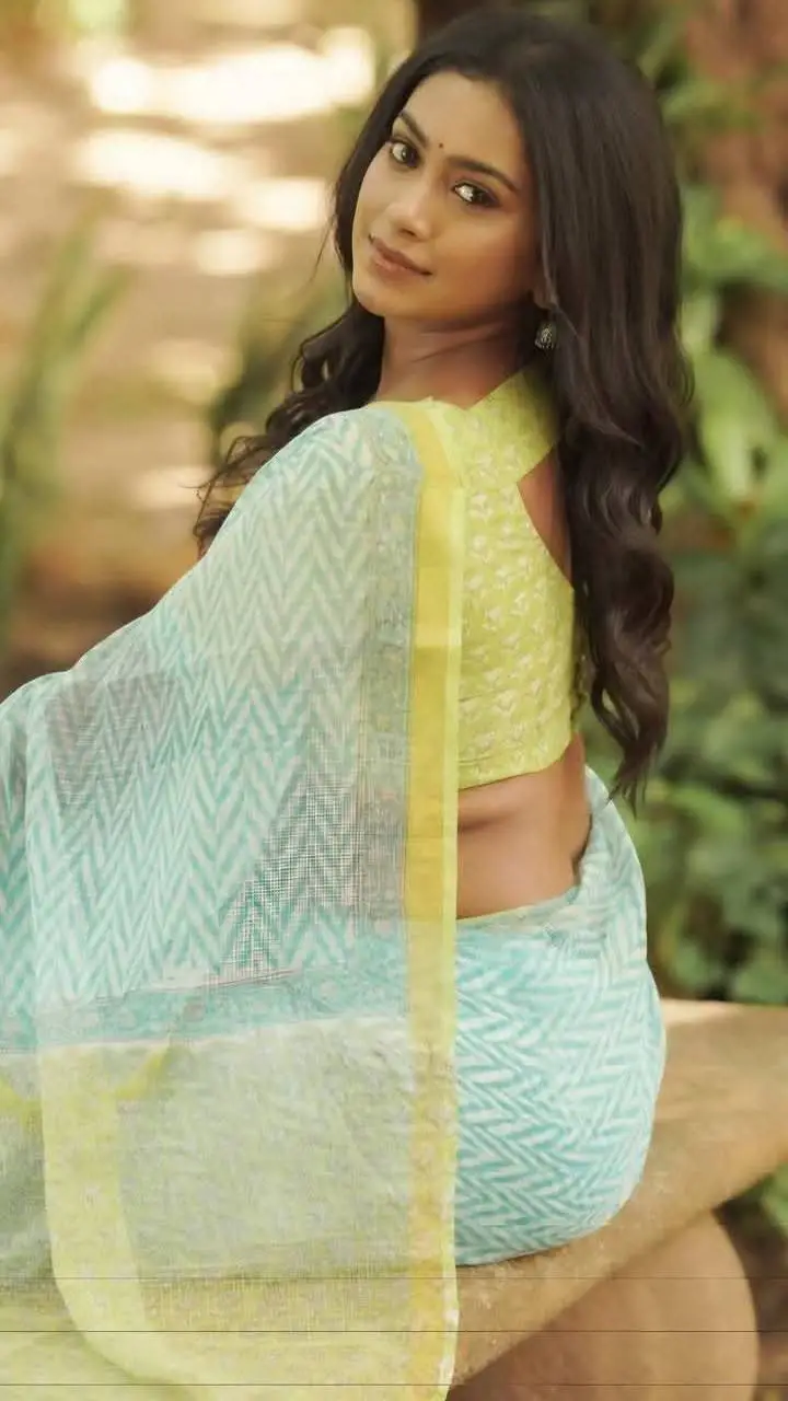 ai character: Anu madam  background