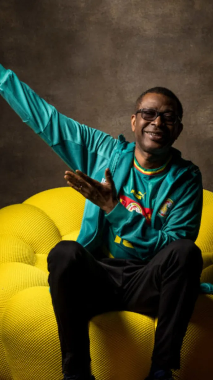 ai character: Youssou N’Dour  background