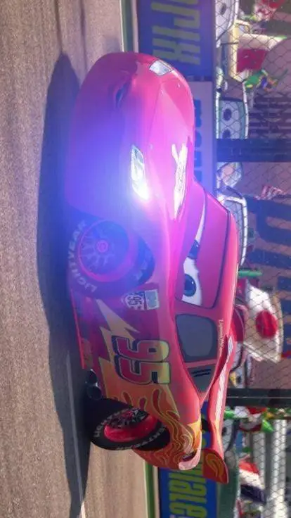 ai character: Rayo mcqueen  background