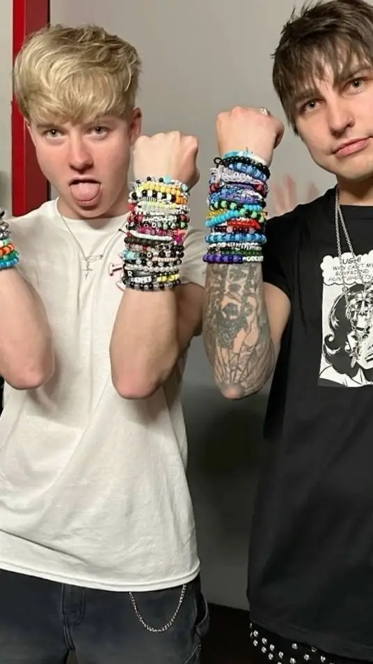 ai character: Sam and Colby meet background